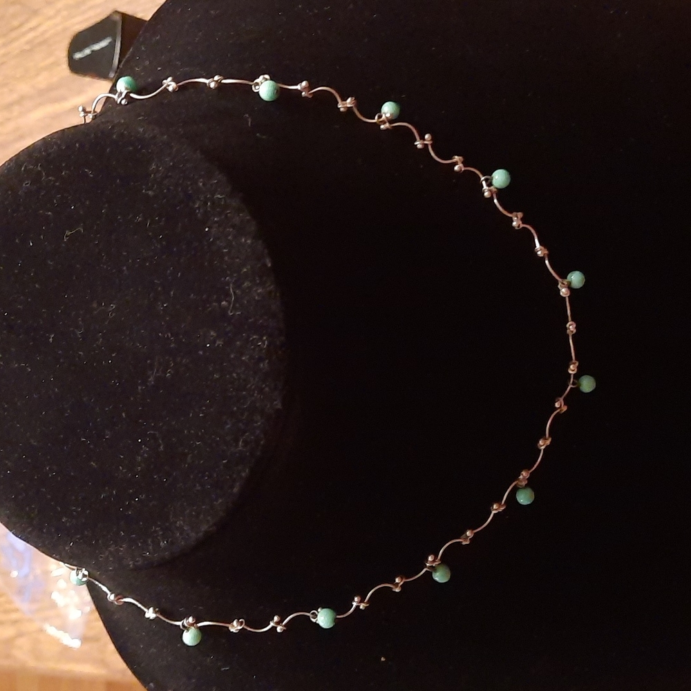 Sterling silver necklace with silver and aqua bead. Marked 925.